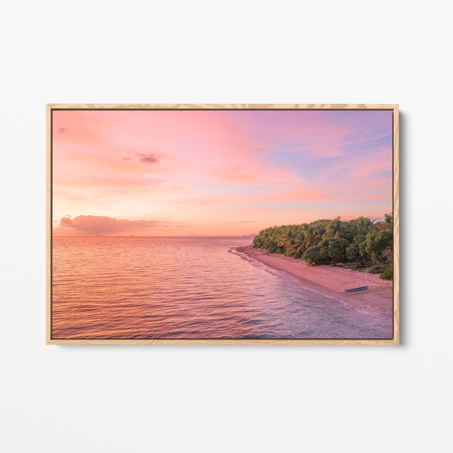 Serenity Island at sunset in Fiji in an oak frame