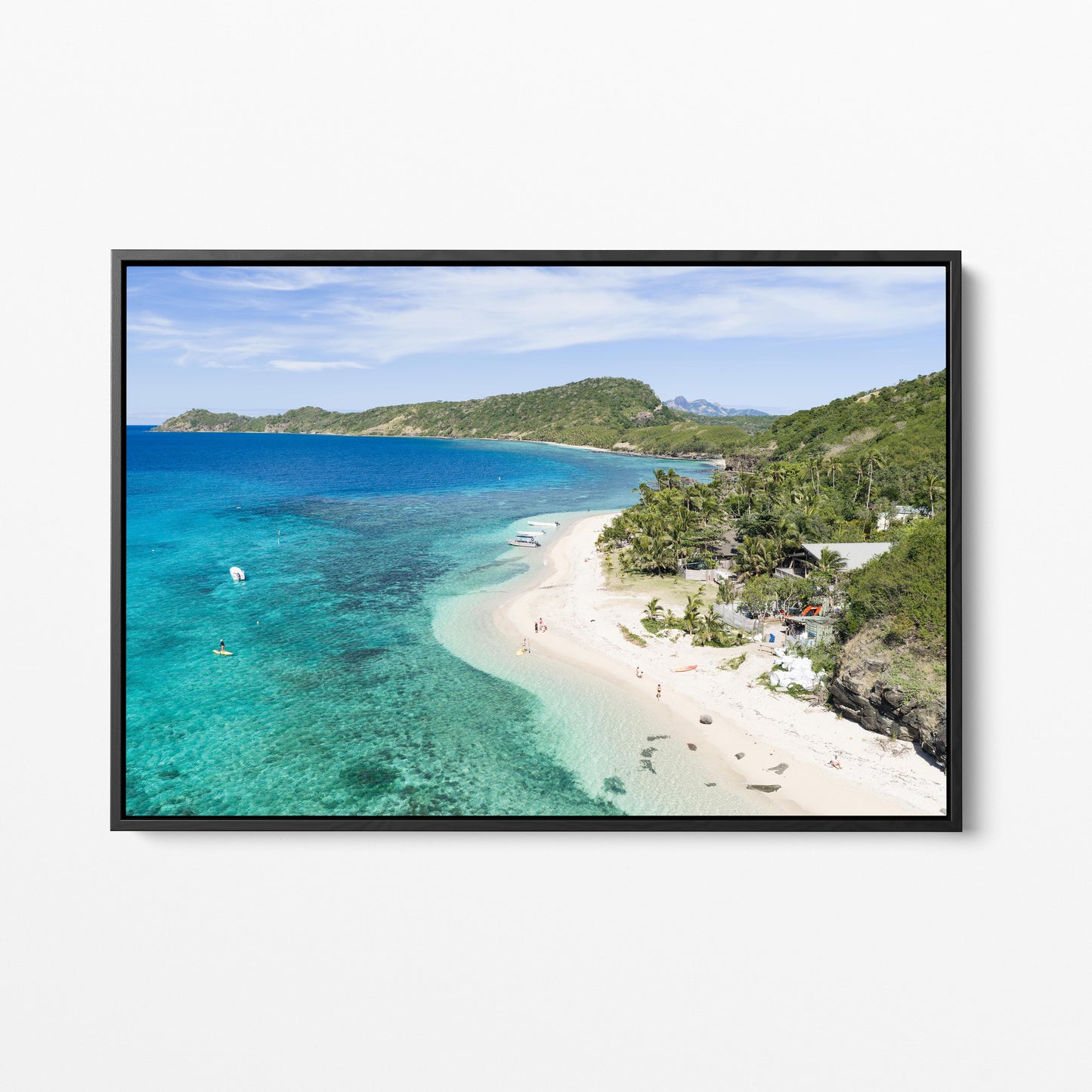 The resort beach at Manta Ray Island in Fiji in a black frame