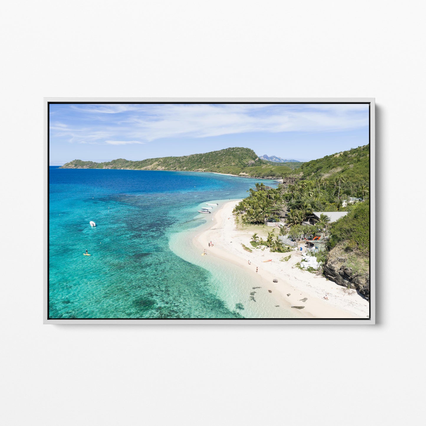 The resort beach at Manta Ray Island in Fiji in a white frame