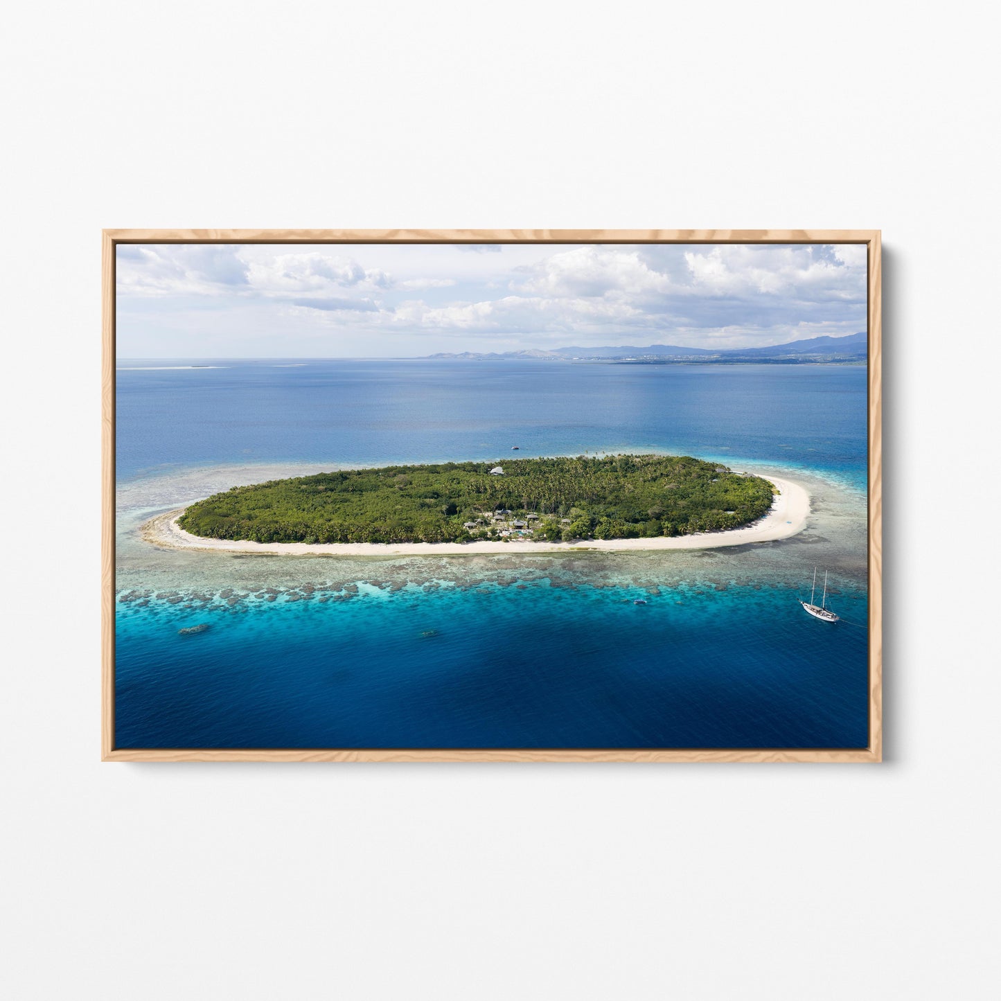 The whole of Serenity Island in Fiji from the air, in an oak frame