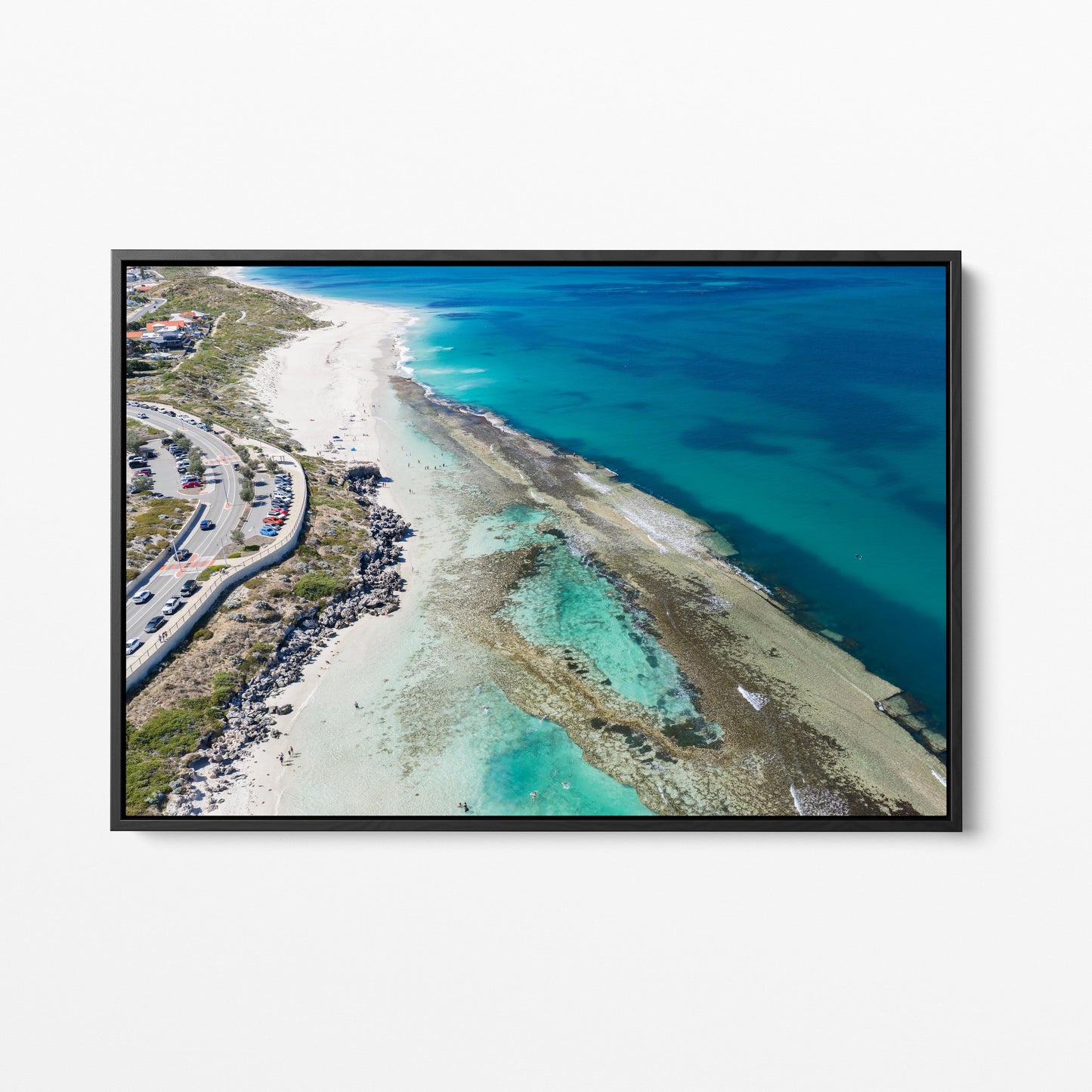 The reef spreading through the water at Yanchep Lagoon, in a black frame