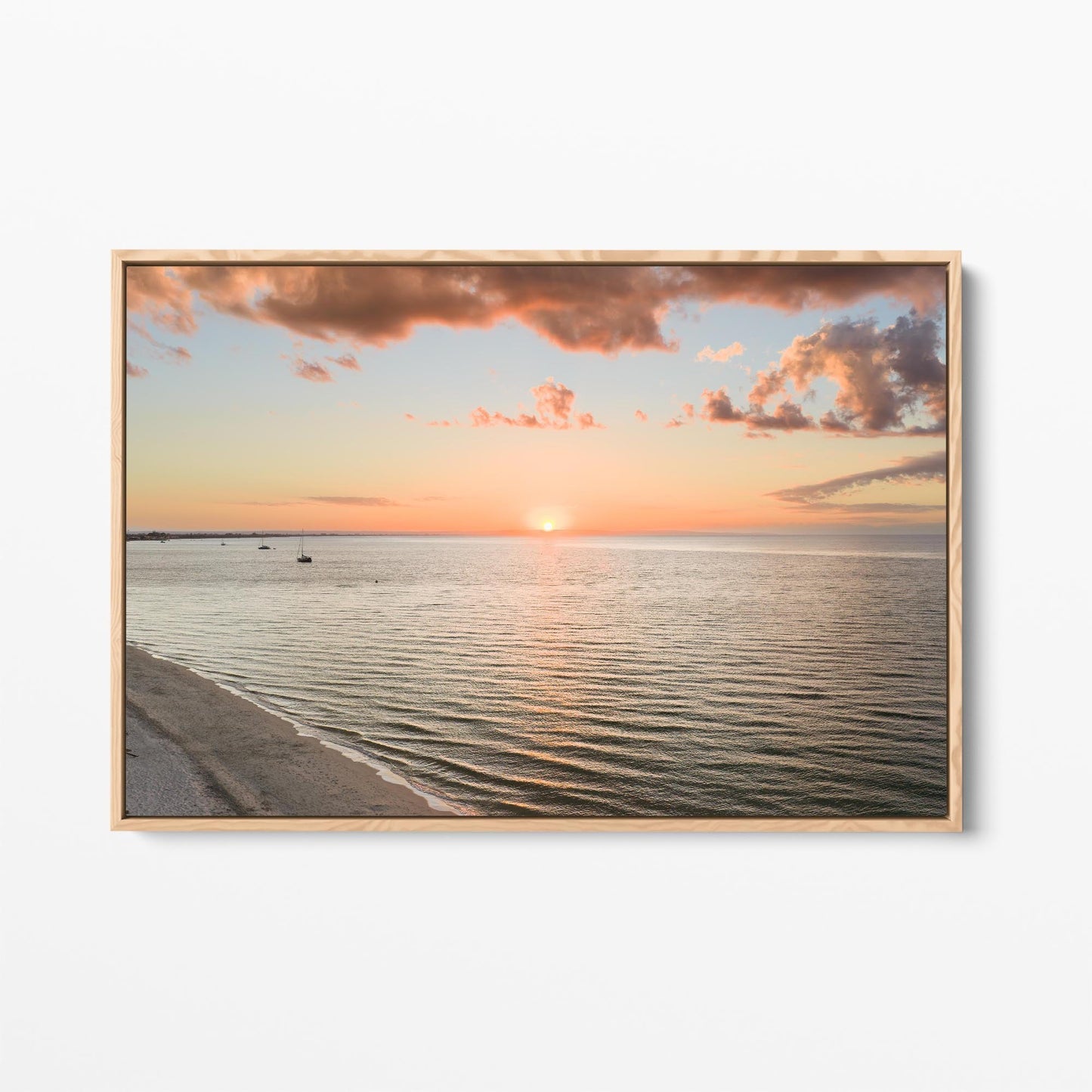Oak framed canvas print of the sun setting over Geographe Bay at Busselton, Western Australia