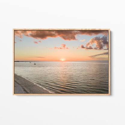 Oak framed canvas print of the sun setting over Geographe Bay at Busselton, Western Australia