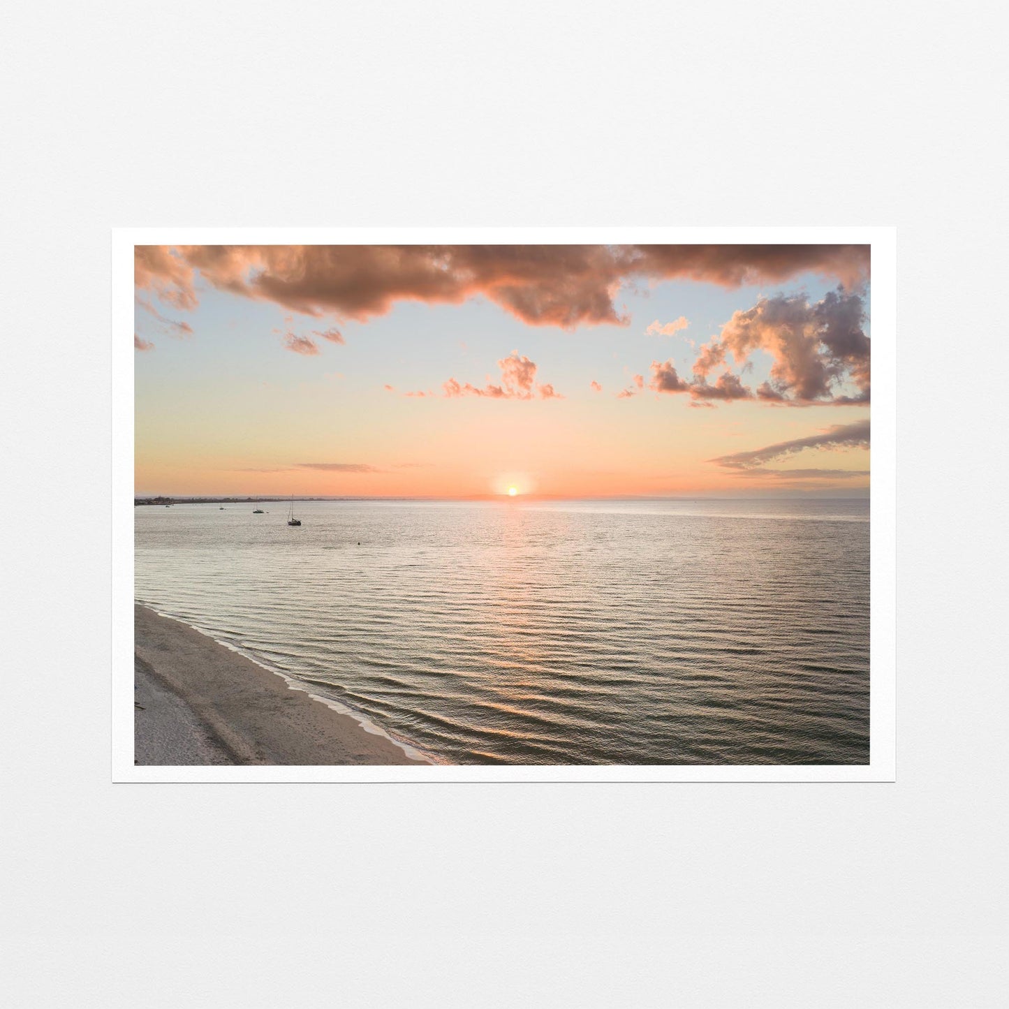 Fine art paper print of the sun setting over Geographe Bay at Busselton, with a white border