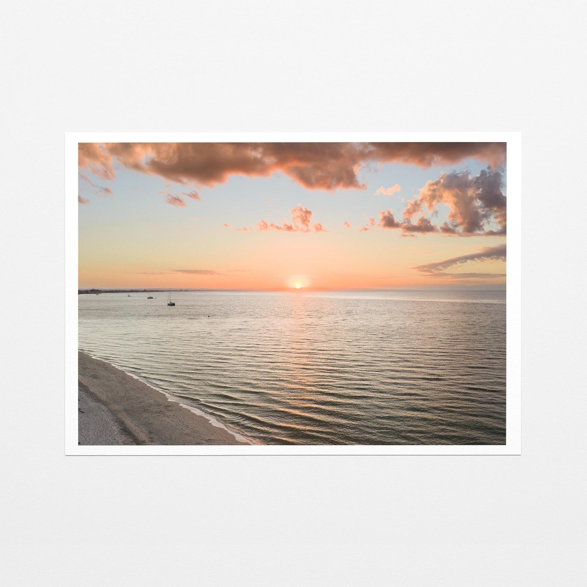 Fine art paper print of the sun setting over Geographe Bay at Busselton, with a white border