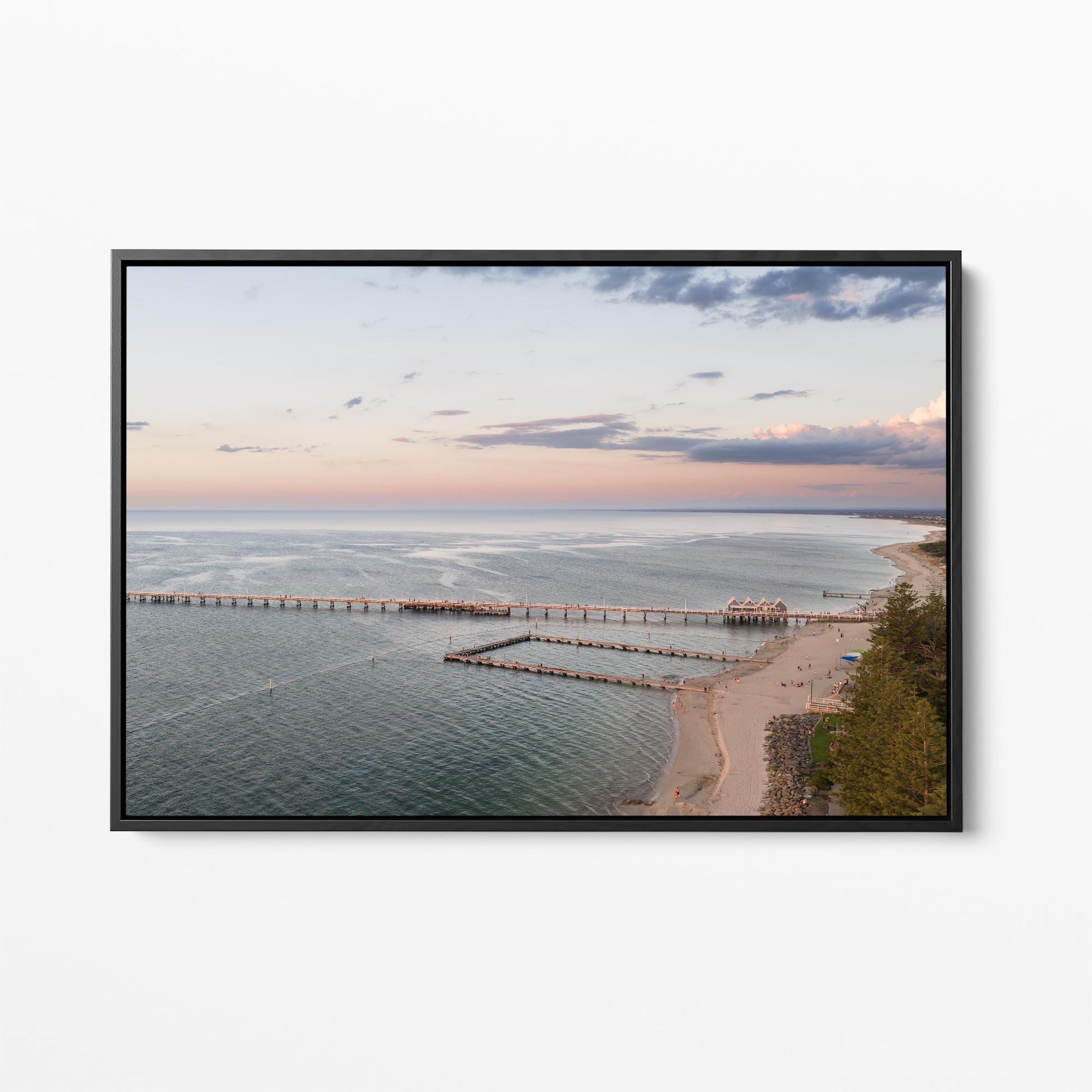 Black framed canvas print of Busselton Jetty across Geographe Bay at sunset, Western Australia