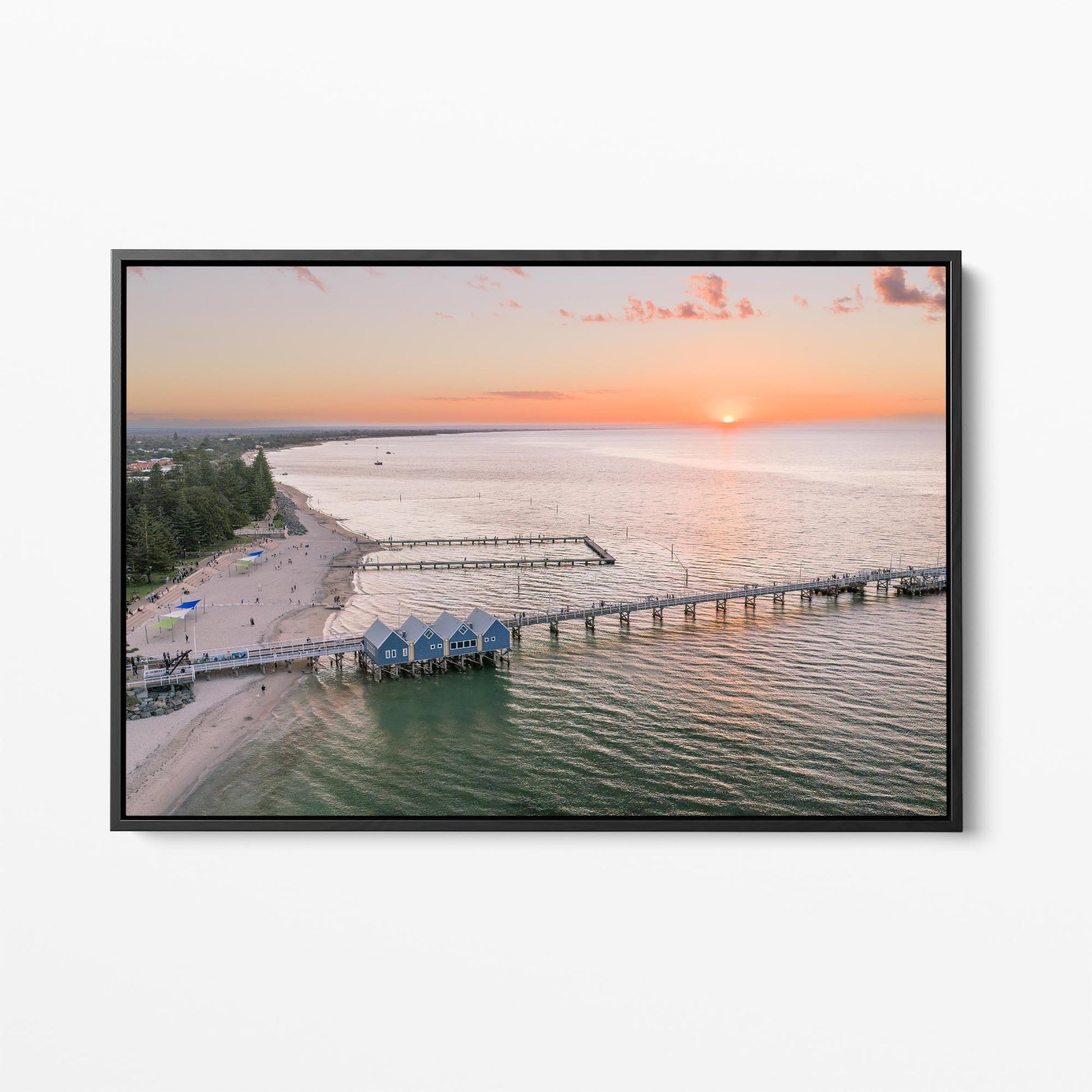 Black framed canvas print of Busselton Jetty and the blue boat sheds at sunset, Western Australia