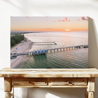 Stretched canvas print of Busselton Jetty and the blue boat sheds at sunset, on a timber bench