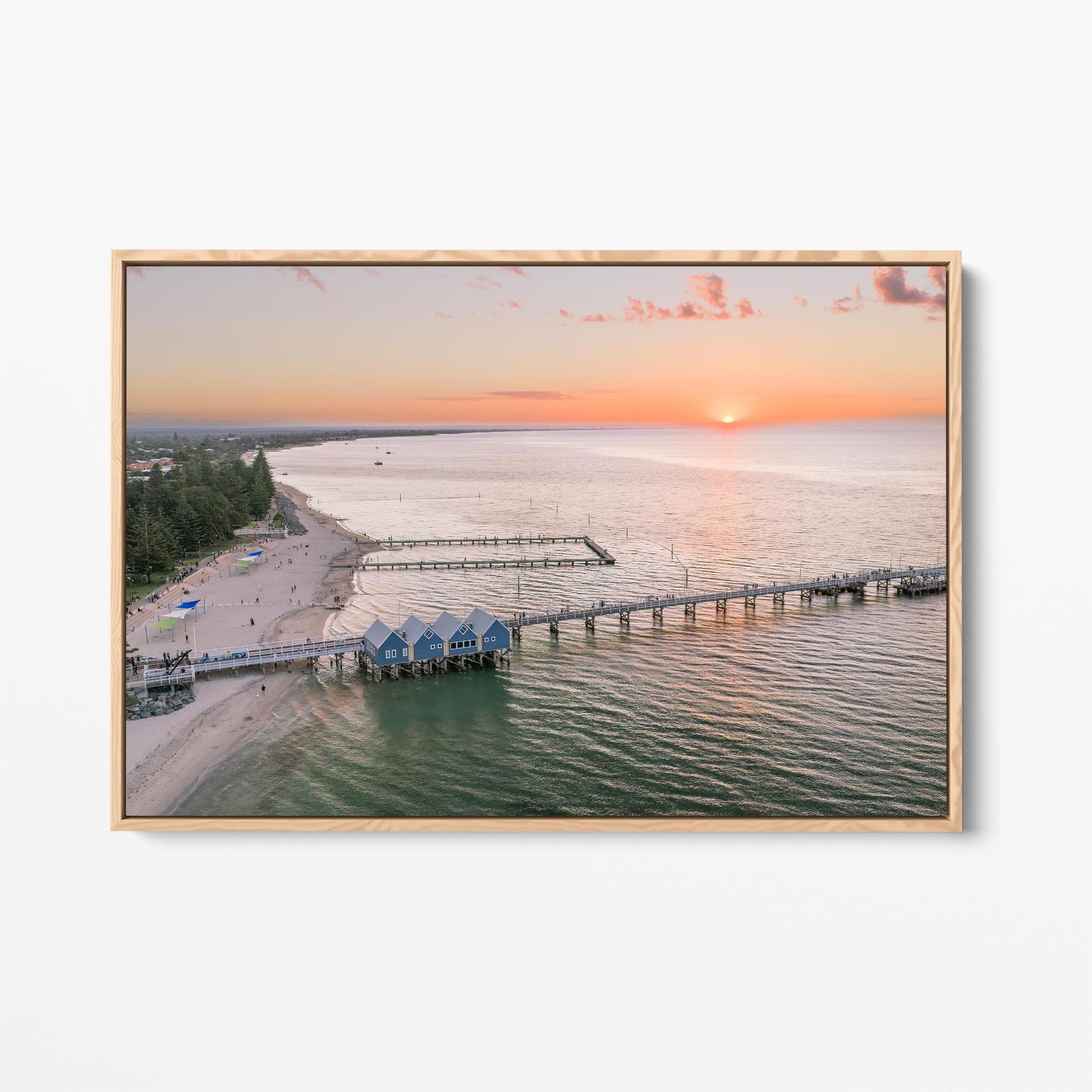 Oak framed canvas print of Busselton Jetty and the blue boat sheds at sunset, Western Australia