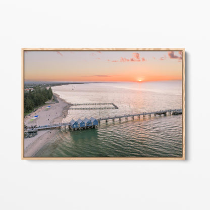 Oak framed canvas print of Busselton Jetty and the blue boat sheds at sunset, Western Australia