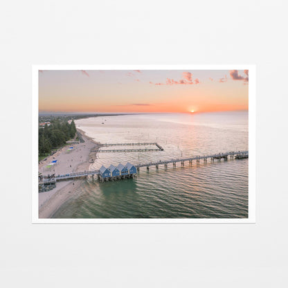 Fine art paper print of Busselton Jetty and the blue boat sheds at sunset, with a white border