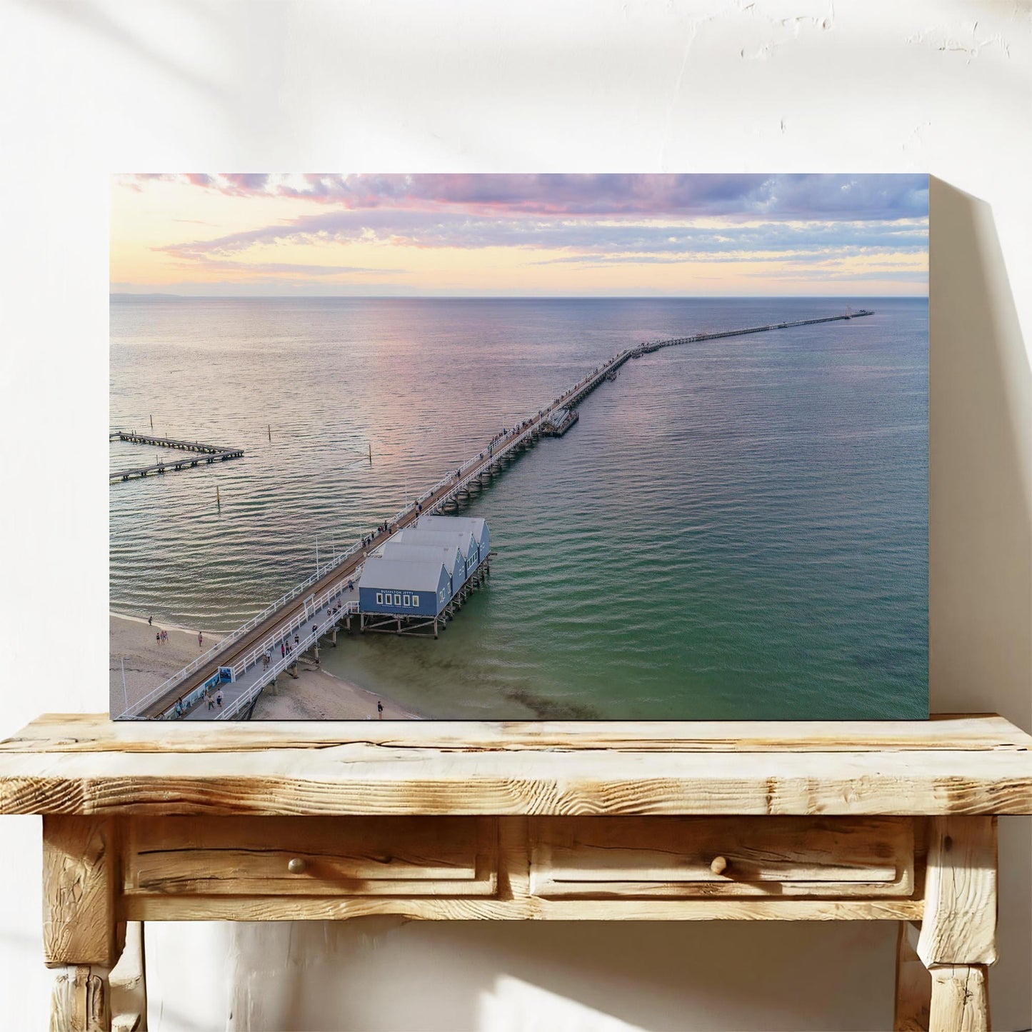 Stretched canvas print of Busselton Jetty running to the horizon after sunset, on a timber bench
