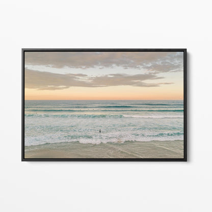 Black framed canvas print of surfers in the lineup at Duranbah Beach at sunset, New South Wales