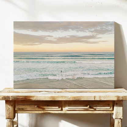 Stretched canvas print of surfers in the lineup at Duranbah Beach at sunset, leaning on a timber bench