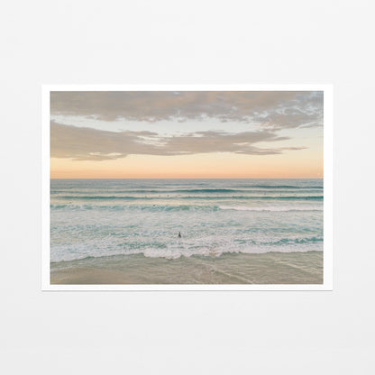 Fine art paper print of surfers in the lineup at Duranbah Beach at sunset, with a white border