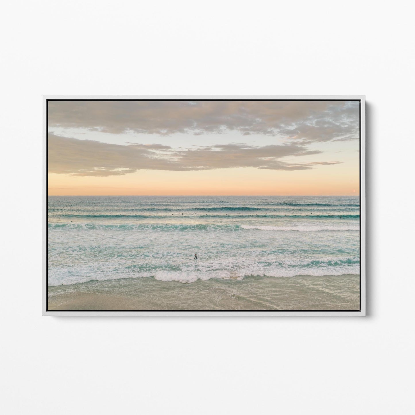White framed canvas print of surfers in the lineup at Duranbah Beach at sunset, New South Wales