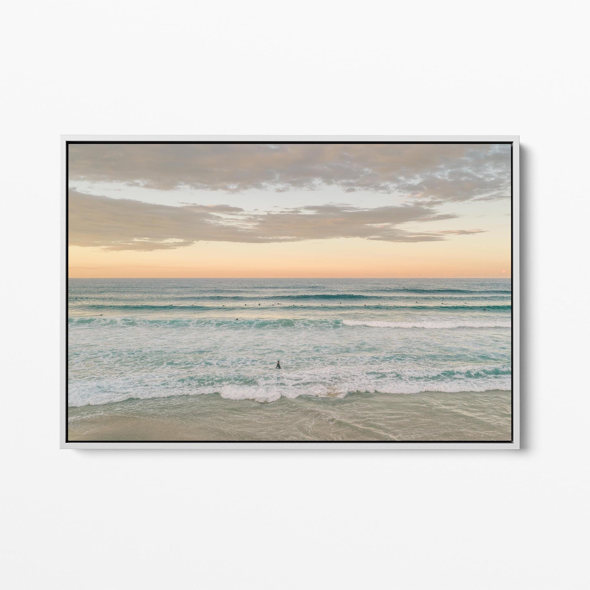White framed canvas print of surfers in the lineup at Duranbah Beach at sunset, New South Wales