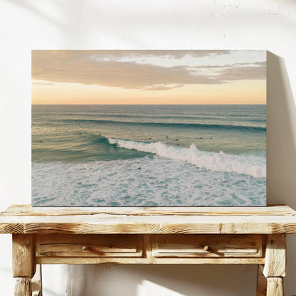 Stretched canvas print of a breaking wave at Duranbah Beach at sunset, leaning on a timber bench