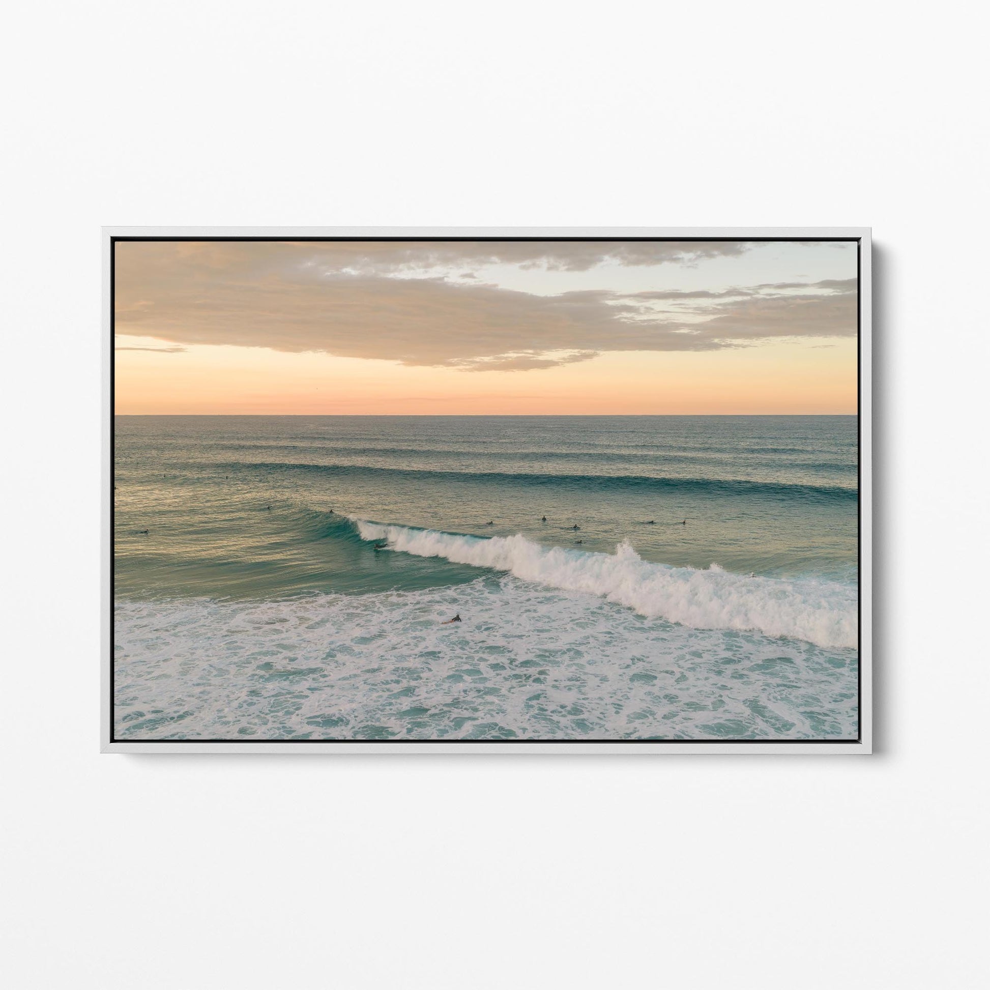 White framed canvas print of a breaking wave at Duranbah Beach at sunset, New South Wales