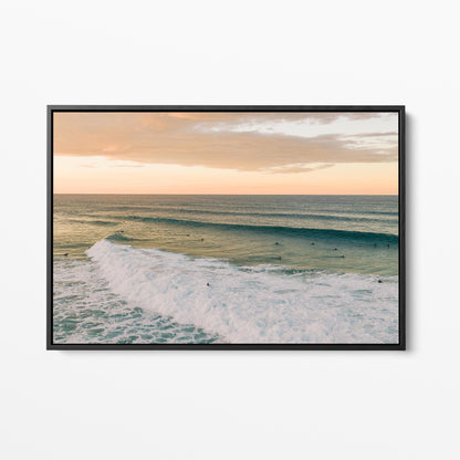 Black framed canvas print of a long line of swell at Duranbah Beach at sunset, New South Wales