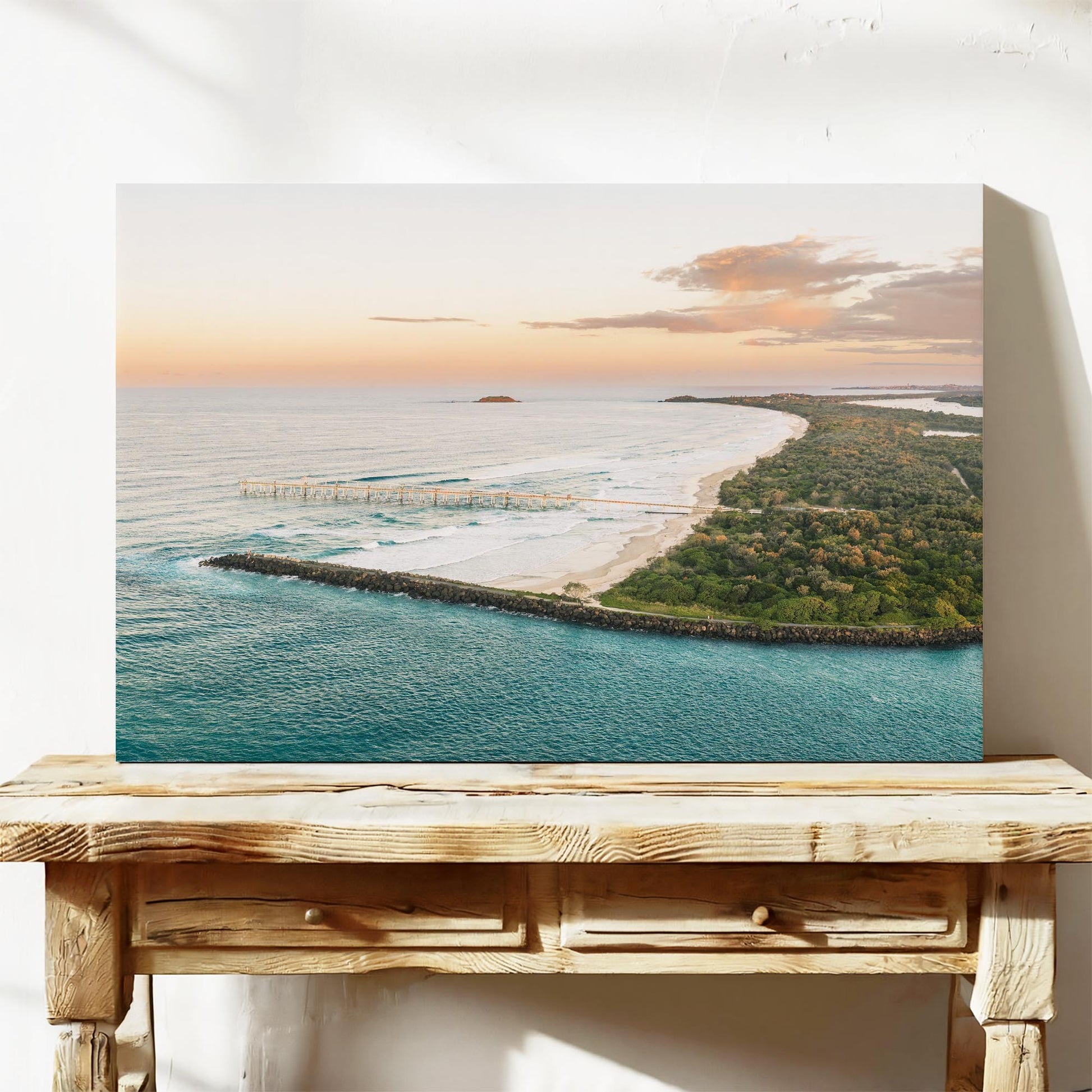 Stretched canvas print of the headland at Duranbah at sunset, leaning on a timber bench