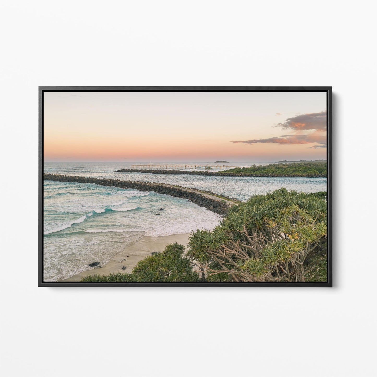 Black framed canvas print of the breakwall at Duranbah Beach at sunset, New South Wales
