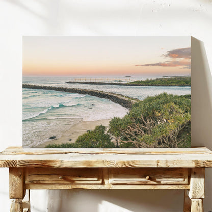 Stretched canvas print of the breakwall at Duranbah Beach at sunset, leaning on a timber bench