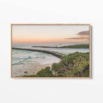 Oak framed canvas print of the breakwall at Duranbah Beach at sunset, New South Wales