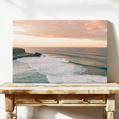 Stretched canvas print of pink sunset cloud over the point at Duranbah, leaning on a timber bench