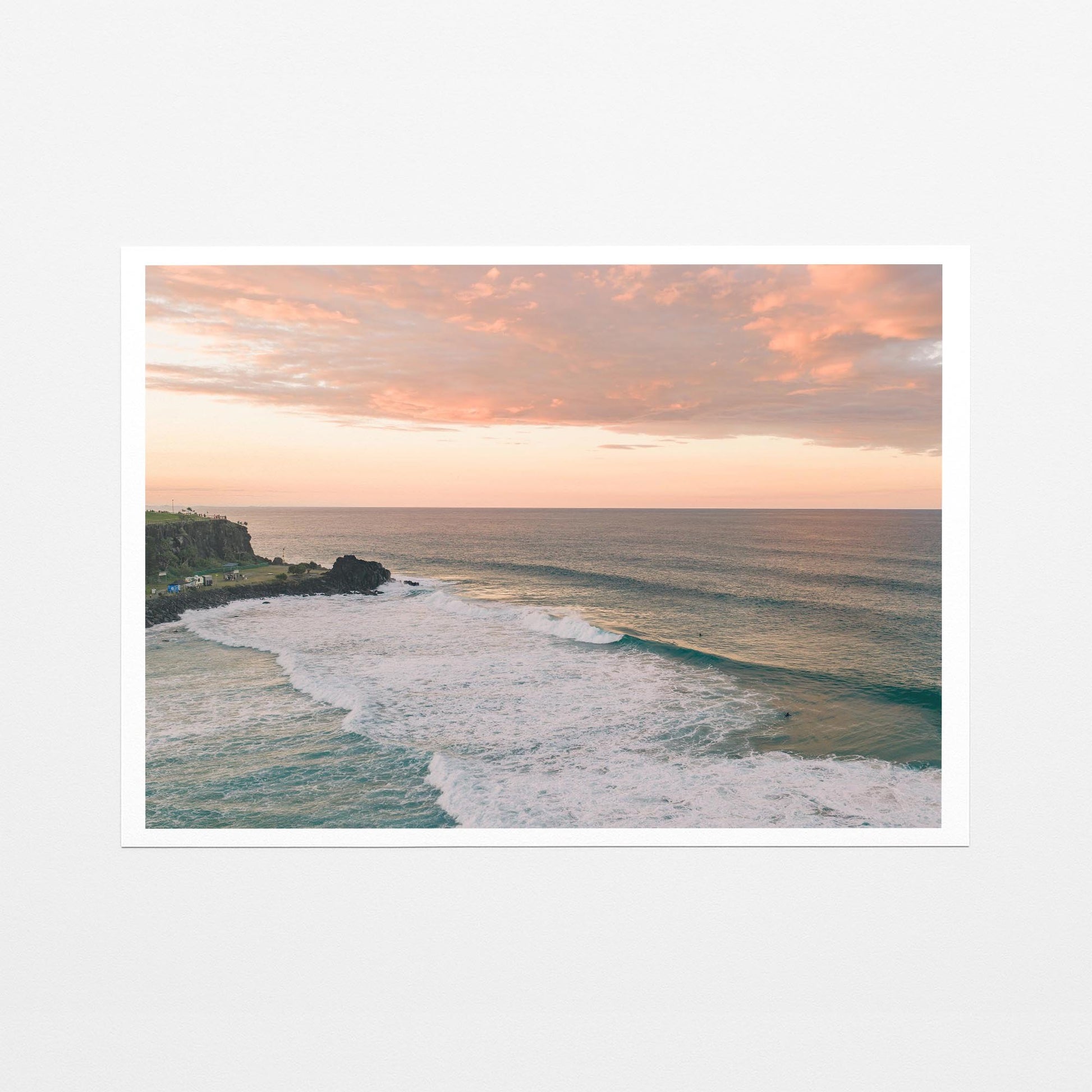 Fine art paper print of pink sunset cloud over the point at Duranbah, with a white border