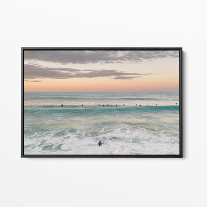 Black framed canvas print of the surfing lineup at Duranbah Beach at sunset, New South Wales