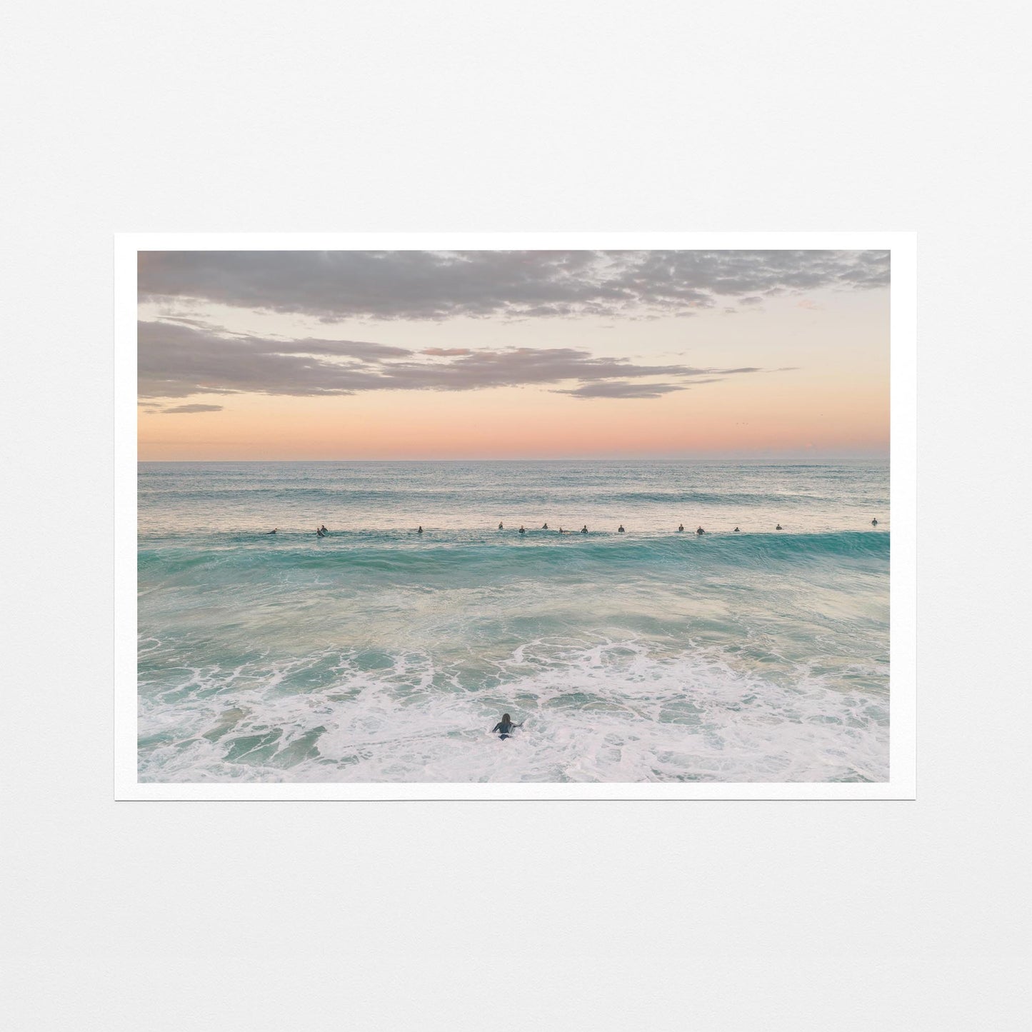 Fine art paper print of the surfing lineup at Duranbah Beach at sunset, with a white border