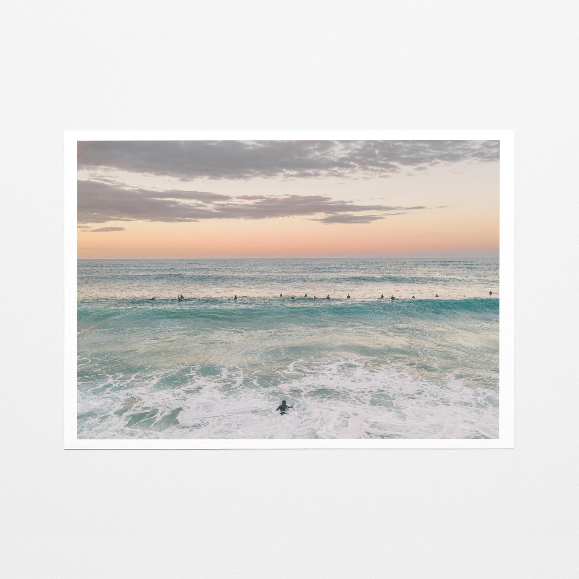 Fine art paper print of the surfing lineup at Duranbah Beach at sunset, with a white border