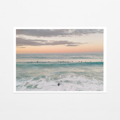 Fine art paper print of the surfing lineup at Duranbah Beach at sunset, with a white border