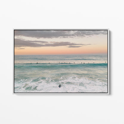 White framed canvas print of the surfing lineup at Duranbah Beach at sunset, New South Wales