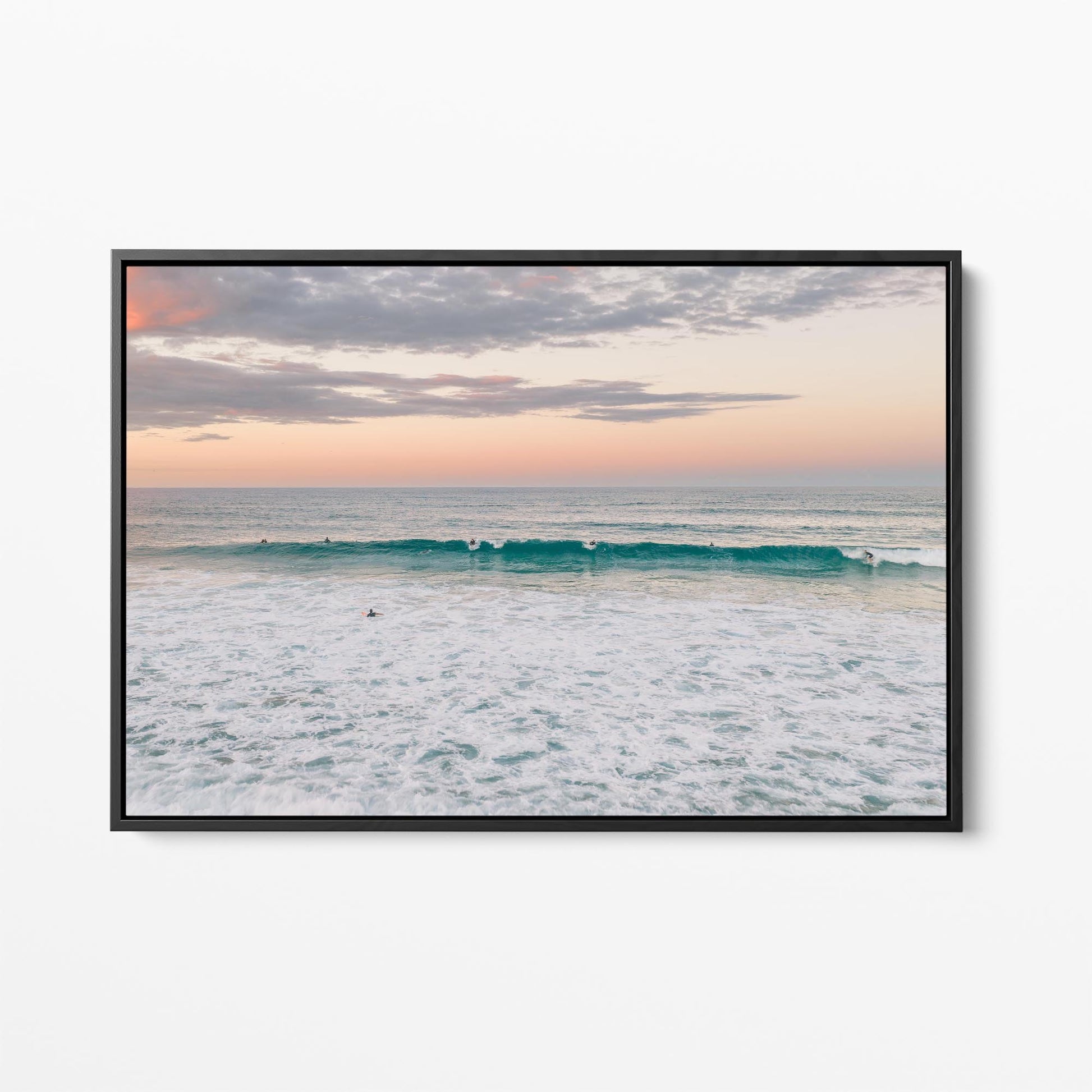 Black framed canvas print of a lone surfer at Duranbah Beach at sunset, New South Wales