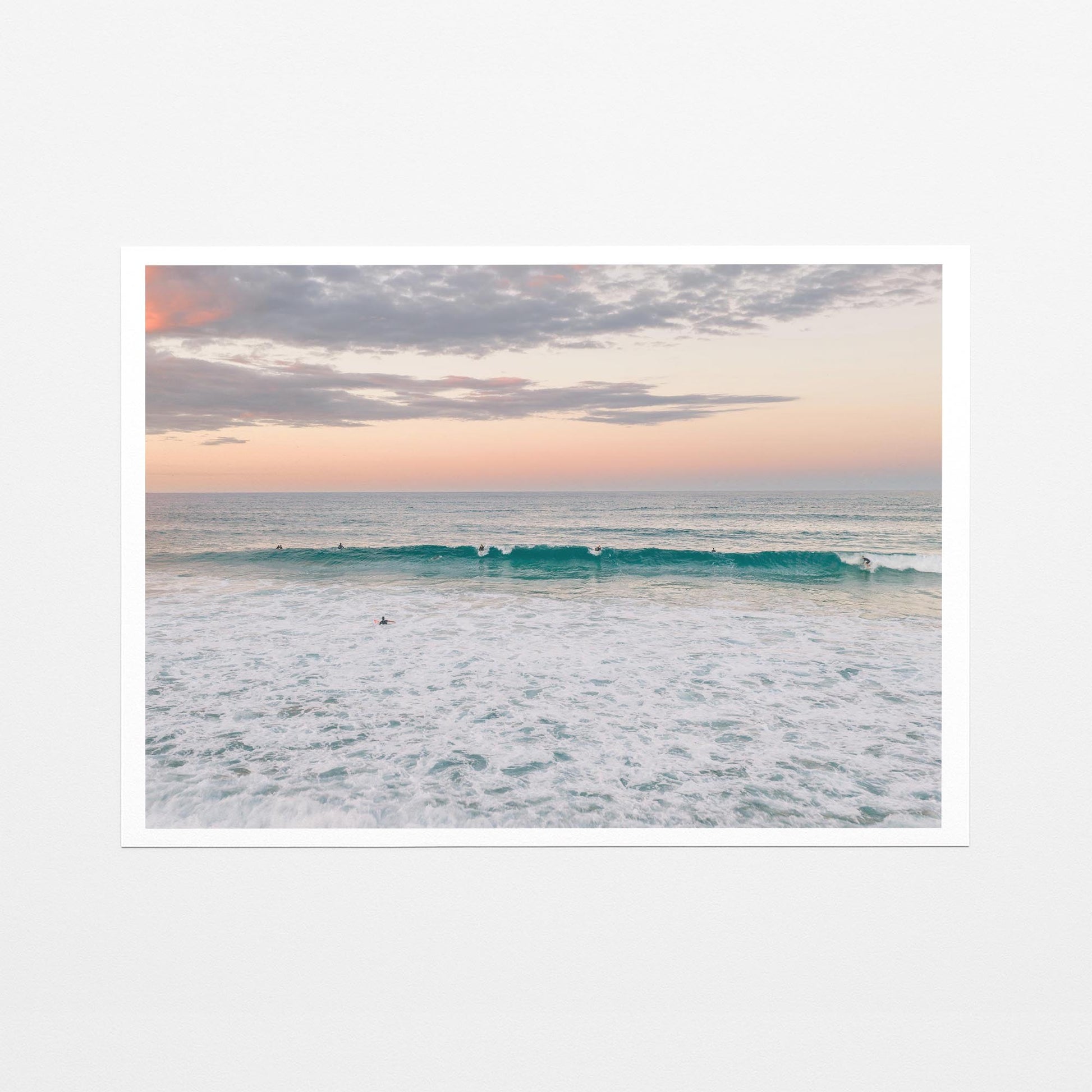 Fine art paper print of a lone surfer at Duranbah Beach at sunset, with a white border