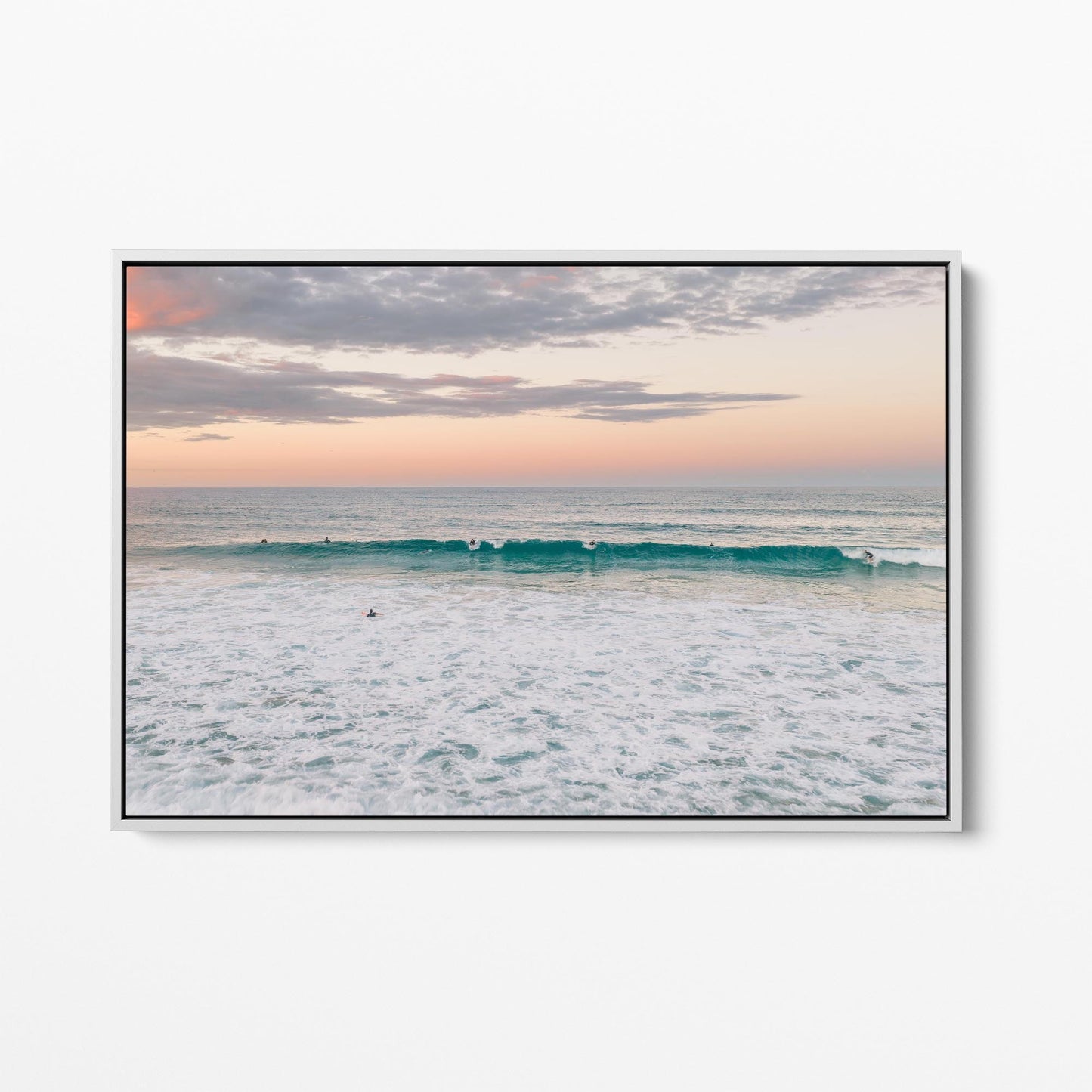 White framed canvas print of a lone surfer at Duranbah Beach at sunset, New South Wales